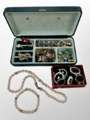 A jewellery box containing pink costume pearl necklace and matching bracelet,