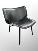 A 20th century Danish and ebonised black vinyl upholstered chair