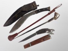 A horn-handled kukri knife in sheath together with a further horn-handled knife in sheath and