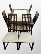 A contemporary marble-effect dining table,