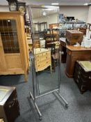 A chrome cheval mirror,