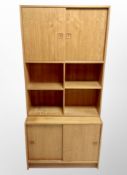 A 1970's Danish teak sliding door wall unit,