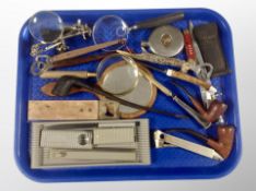 A group of collectables, letter knife in the form of a bayonet, magnifying glasses, bottle openers,