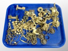 A group of brass drawer handles, door fittings,