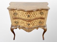 A 19th century Danish walnut and parquetry serpentine front two drawer chest on cabriole legs,