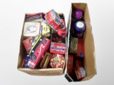 Two boxes containing tins