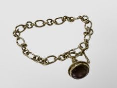 A 9ct gold bracelet with amethyst fob CONDITION REPORT: 12.