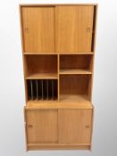 A 1970's Danish teak sliding door wall unit,