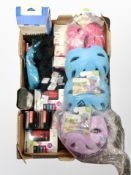 A box of cycling accessories to include children's helmets, inner tubes, bike like,