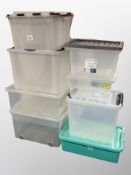 Eight plastic storage boxes
