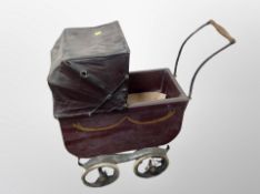 An early 20th century doll's pram