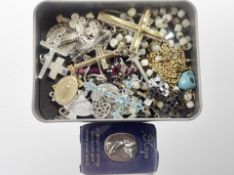 A group of crucifixes and crosses, some silver,