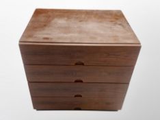 A 20th century Danish rosewood-effect four drawer low cabinet,