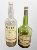 A large Bells whisky bottle,