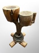 A naturalistic wooden smoker's stand,