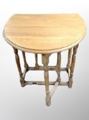 An oak drop leaf gateleg table,