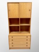 A 1970's Danish teak sliding door wall unit,