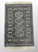 A Lahore Bokhara rug on blue ground 103 cm x 62 cm