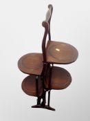 An Edwardian mahogany cake stand,