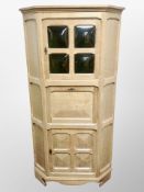 A Danish blond oak corner cabinet,