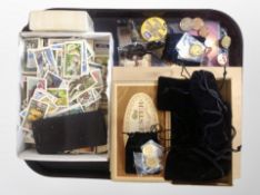 A tray of Brooke Bond cigarette cards, coins,