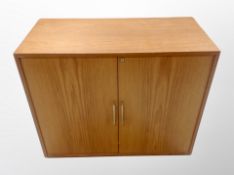 A 1970's teak effect double door office cabinet,