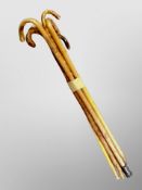 A bundle of vintage wooden walking sticks