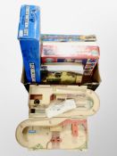 A box of games and toys, hot wheels racing set,