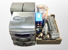 A Sanyo hifi system with speakers, and a box of G-tech vac, Vax hand held vac, radio,