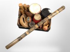 A box of African drums, digeridoo, maraca,