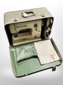 A Bernina minimatic electric sewing machine with lead and pedal in box