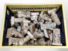 A crate of contemporary resin ornaments