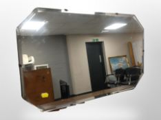 An Art Deco frameless octagonal mirror 69 cm x 41 cm