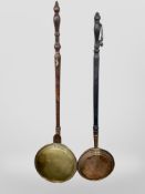 A Victorian brass bed warming pan and a copper example