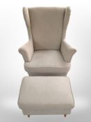 A late 20th century Danish wingback armchair and matching footstool