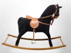 A Mamas and Papas rocking horse,