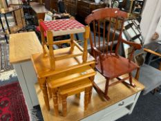 A nest of three pine tables,