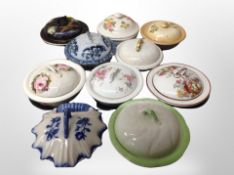 Two trays of porcelain lidded dressing table pots,