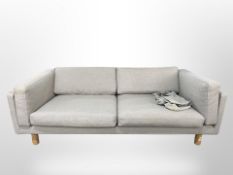 A late 20th century Danish three seater settee in grey fabric,