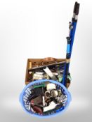 A box and basket of paint brushes, spirit level,