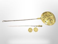 An early 19th century brass and cast iron chestnut roaster,