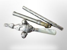 A silver and mother of pearl rattle depicting a rabbit, length 10.