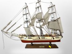 A model of a three masted clipper on stand,