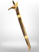 A bundle of five vintage wooden walking sticks including bone-handled example