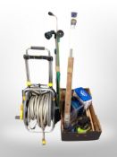 A hose pipe on reel and a box of extension reel, hose attachments,