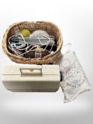 A Frister Rossman sewing machine and wicker basket containing knitting needles and wool