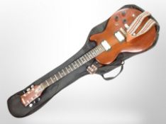 An Eros electric guitar in soft carry case