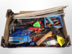 A box of various tools, claw hammers, drill bits, screw drivers,