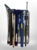 A folding camping chair, two fishing rods in tubes, fishing rod rest,