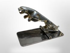 A chromed Jaguar car mascot, later mounted as a desk paper tidy, length 10.